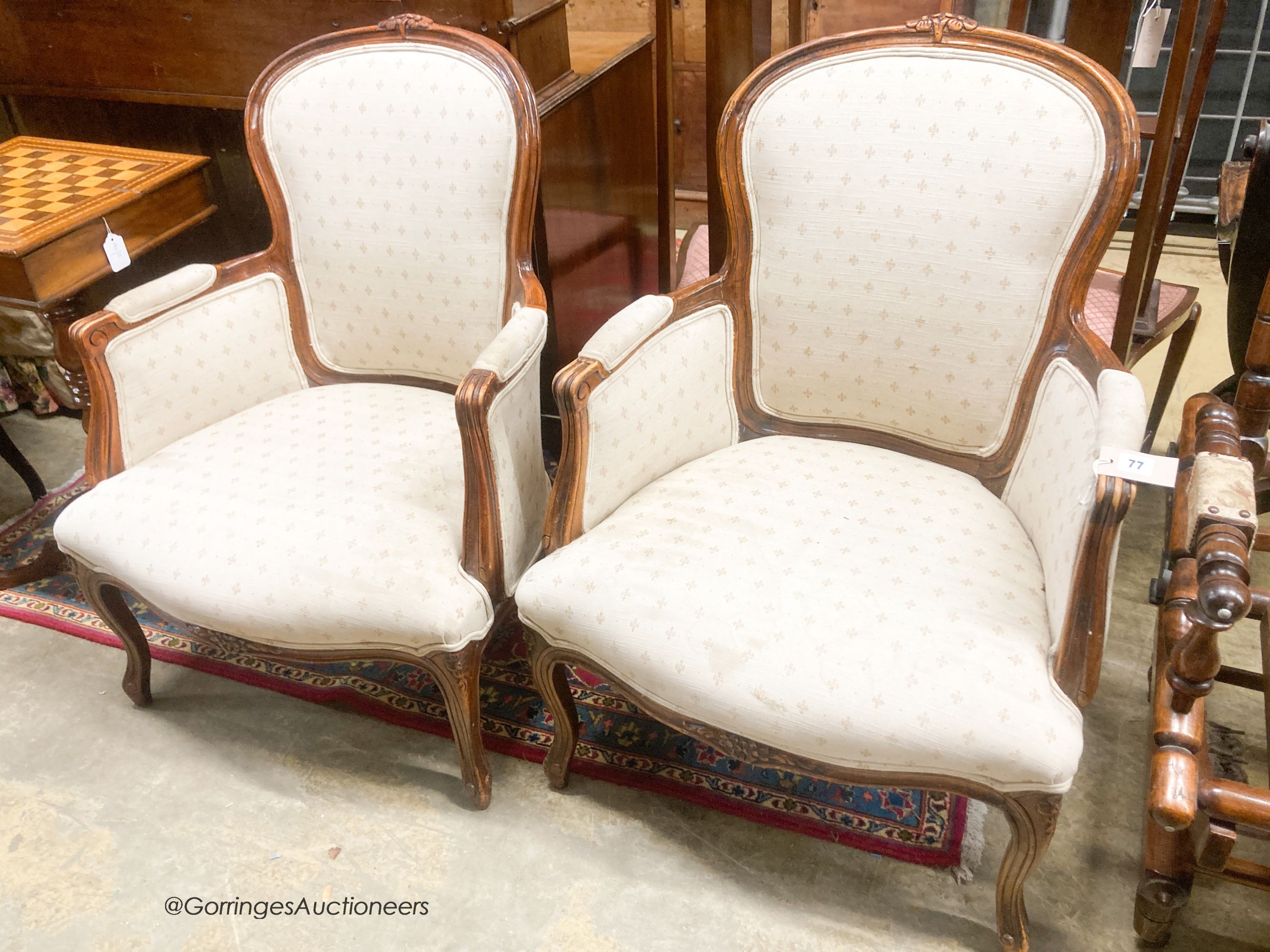 A pair of Louis XV style mahogany fauteuils, width 66cm, depth 55cm, height 94cm